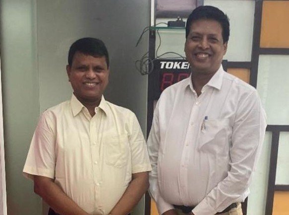 Dr. Harish K. V with Father Norman
